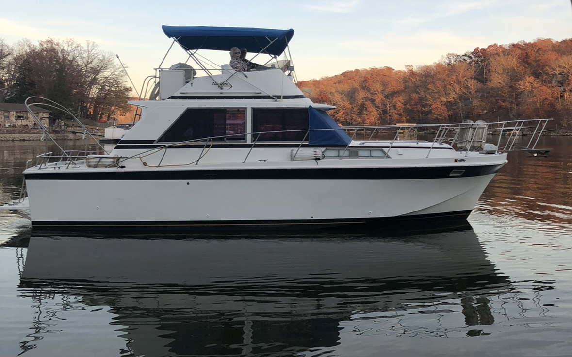 Joe Huser and his mother on the family 1973 Uniflite Cruiser at the Lake of the Ozarks